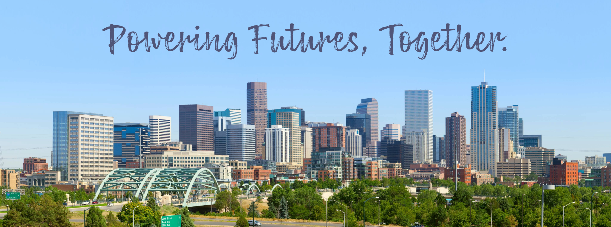 A photo of the downtown Denver skyline with title text reading "Powering Futures, Together."